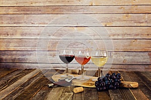 Wine flight with grapes, cork and bottle opener