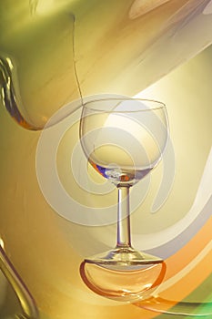 Wine glass on an abstract colored background