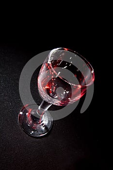 Wine glass with beautiful red glares
