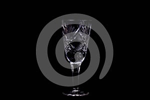 The wine glass on black background