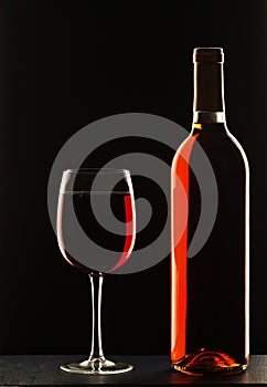 Wine glass and bottle of red wine
