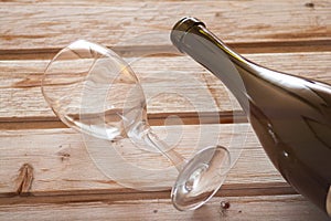 Wine glass with bottle on wooden background dreamy loo