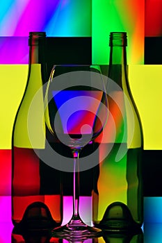 Wine glass & bottles photo