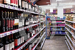 Wine in glass bottles in supermarket