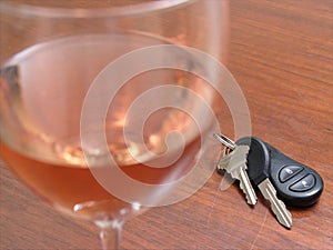 A wine glass with car keys
