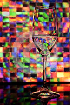 Wine glass with colorful background