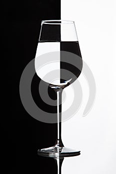 Wine glass with domino effect. Wineglass with liquid - refraction