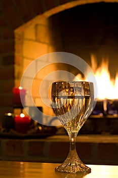 Wine glass by fire in home