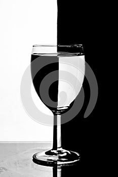 Wine glass photographyand  product photography using light effects and low light on a black background