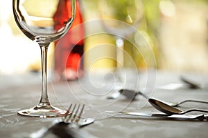 Wine glass and place setting in a restaurant photo