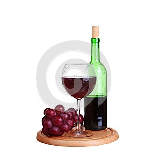 wine glass with red wine, bottle of wine and grapes isolated over white background