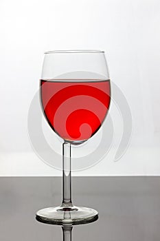 Wine glass with red liquid