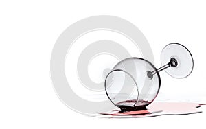 Wine glass with red wine lies on glass on white background