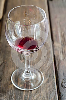 Wine glass on rustic wooden tabletop