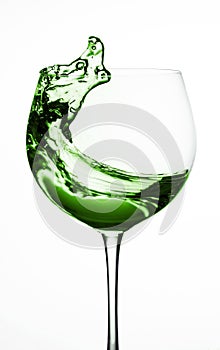 Wine glass, splash of wine red water on a white background isolated