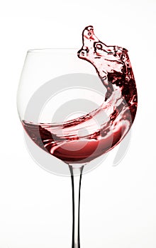 Wine glass, splash of wine red water