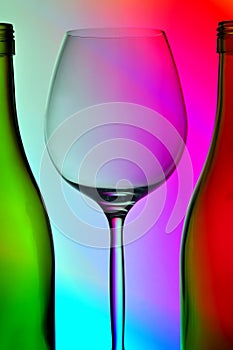 Wine glass and two bottles