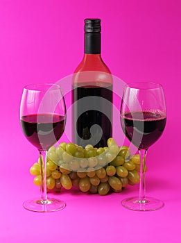 Wine glasses and bottle with grapes