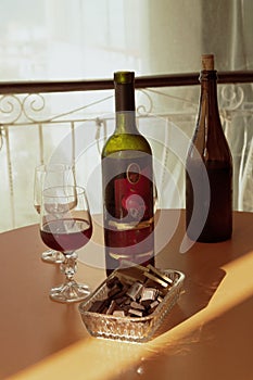 Wine glasses and bottles with chocolate