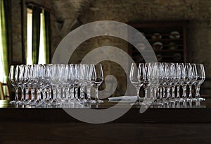 Wine glasses in Chateau de Savigny dark room near Beaune in Burgundy, France