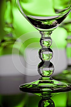 Wine glasses with green background