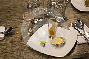 Wine glasses with napkins, glasses and gourmet food, banquet table
