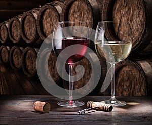 Wine glasses on the old wooden table. Winetasting at the wine cellar