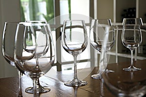 Wine glasses standing on the bar in the tasting room