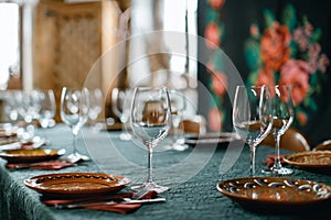 Wine glasses and table serving in rustic style restaurant