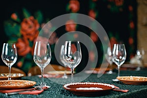 Wine glasses and table serving in rustic style restaurant