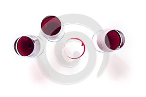 Wine glasses and a wine ring, shot from the top on a white background