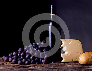 Wine, grapes, cheese and bread