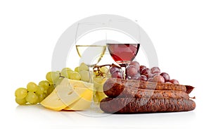 Wine and grapes isolated on white with cheese and sausage