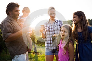 Wine grower family in vineyard