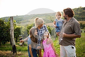 Wine grower family in vineyard