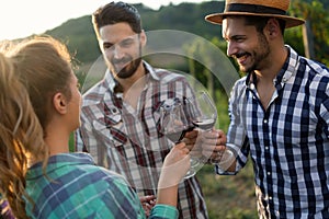 Wine grower and people in vineyard