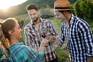 Wine grower and people in vineyard photo