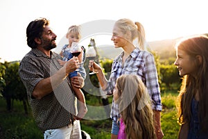 Wine growers tasting wine in vineyard nature