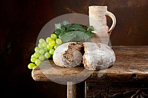 Wine jug with rustic bread photo