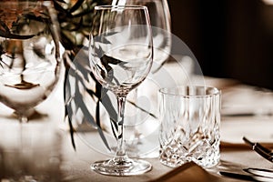 Crystal glasses on a dinner table photo