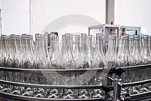 Wine production line - unlabeled bottles