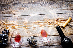 Wine set with bottle and grape on desk top view mockup