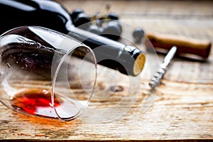 Wine set with bottle and grape on wooden desk