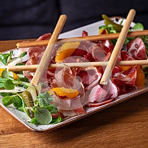 Wine set prosciutto, ventricina, bresaola and grissini bread sticks. Traditional Italian antipasti