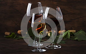 Wine set. Red, white and rose wine in assortment in wineglasses. Wine tasting, vintage wooden background, selective focus, copy