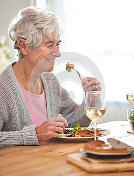 Wine, smile and senior woman at lunch at table with health, celebration and relax in nursing home. Food, drinks and old