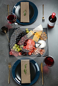 Wine and snacks served for dinner on table in restaurant