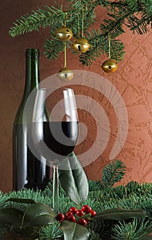 Wine and sprig of holly