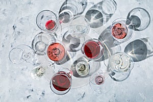 Wine tasting concept - glass with different wine on marble background