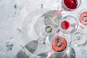 Wine tasting concept - glass with different wine on marble background